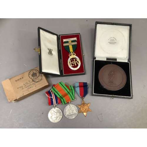 312 - A Queen Elizabeth II Territorial medal 1952 in original box for Major G D Paterson together with Def... 