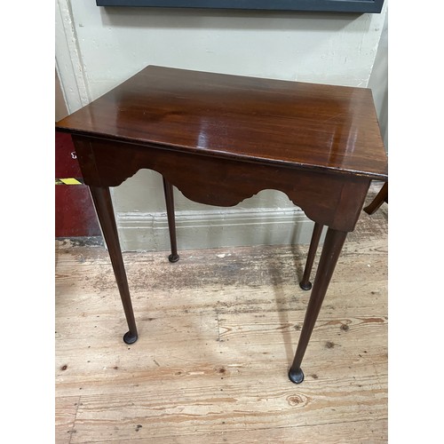 298 - An 18th century and later mahogany table, rectangular, having a deep wavy apron, slender rounded leg... 