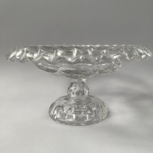 218 - A PAIR OF MID 18TH CENTURY IRISH GLASS PEDESTAL BOWLS, circular with petal edges and disc cut centre... 