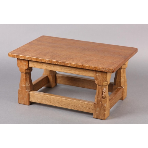 458 - THOMPSON OF KILBURN 'MOUSEMAN' An oak footstool, rectangular, on turned and square framing carved in... 