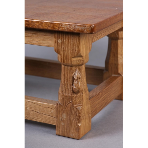 458 - THOMPSON OF KILBURN 'MOUSEMAN' An oak footstool, rectangular, on turned and square framing carved in... 