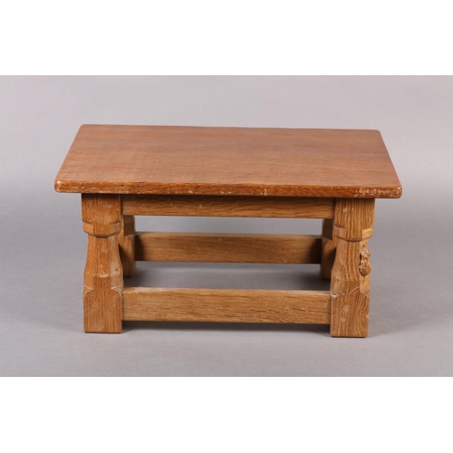 458 - THOMPSON OF KILBURN 'MOUSEMAN' An oak footstool, rectangular, on turned and square framing carved in... 