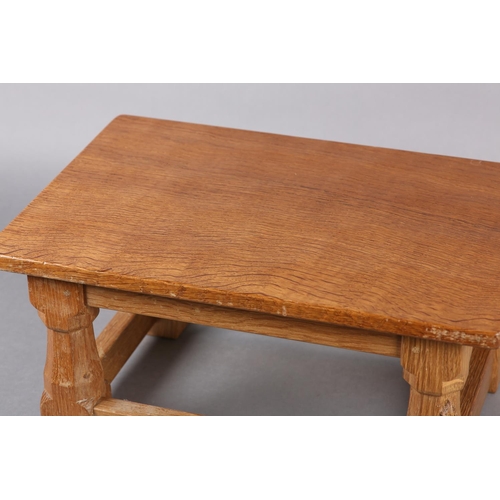 458 - THOMPSON OF KILBURN 'MOUSEMAN' An oak footstool, rectangular, on turned and square framing carved in... 