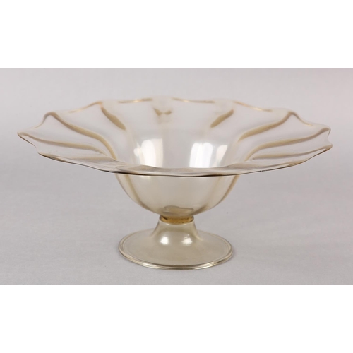 212 - A 19TH CENTURY MURANO PALE AMBER PEDESTAL BOWL, having a wavy everted rim of scalloped outline, on a... 