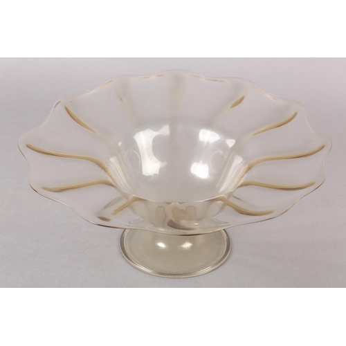 212 - A 19TH CENTURY MURANO PALE AMBER PEDESTAL BOWL, having a wavy everted rim of scalloped outline, on a... 