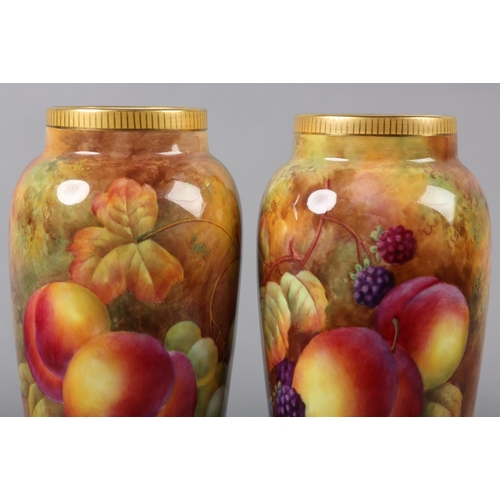 233 - A PAIR OF ROYAL WORCESTER PORCELAIN VASES BY HORACE H PRICE, painted with peaches, grapes and cherri... 