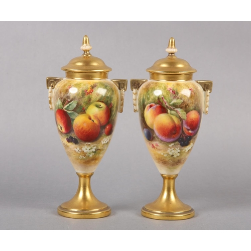 234 - A PAIR OF ROYAL WORCESTER PORCELAIN TWO HANDLED VASES AND COVERS BY WILLIAM RICKETTS, the tapered bo... 