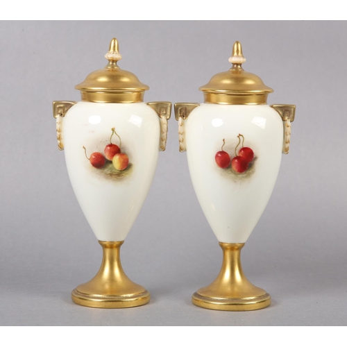 234 - A PAIR OF ROYAL WORCESTER PORCELAIN TWO HANDLED VASES AND COVERS BY WILLIAM RICKETTS, the tapered bo... 