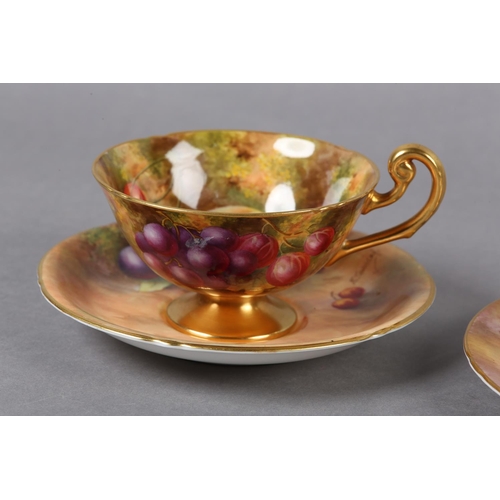 255 - A ROYAL WORCESTER PORCELAIN TRIO BY E TOWNSEND AND HARRY AYRTON, the cup, saucer and tea plate paint... 