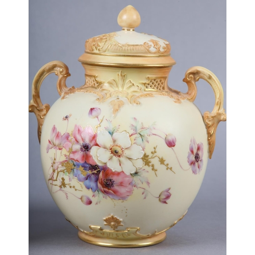 262 - A ROYAL WORCESTER BLUSH IVORY VASE and cover, having twin moulded handles, the ovoid body enamelled ... 