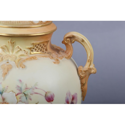 262 - A ROYAL WORCESTER BLUSH IVORY VASE and cover, having twin moulded handles, the ovoid body enamelled ... 