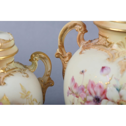 262 - A ROYAL WORCESTER BLUSH IVORY VASE and cover, having twin moulded handles, the ovoid body enamelled ... 