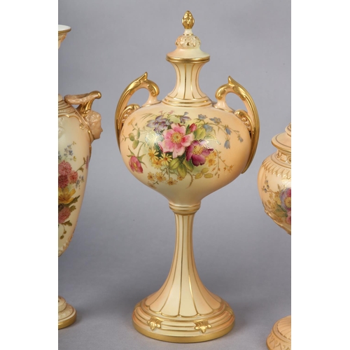 263 - THREE ROYAL WORCESTER BLUSH IVORY VASES one having a pierced cover with finial, the ovoid body ename... 