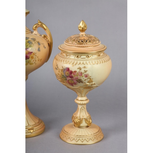 263 - THREE ROYAL WORCESTER BLUSH IVORY VASES one having a pierced cover with finial, the ovoid body ename... 