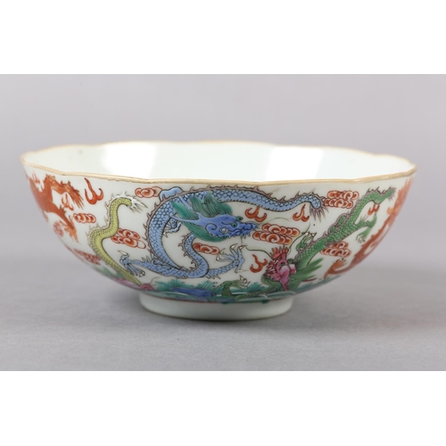 283 - A QING DYNASTY CHINESE BOWL, the body painted in polychrome enamels with intertwining dragons among ... 