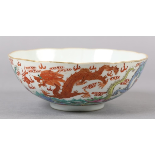 283 - A QING DYNASTY CHINESE BOWL, the body painted in polychrome enamels with intertwining dragons among ... 