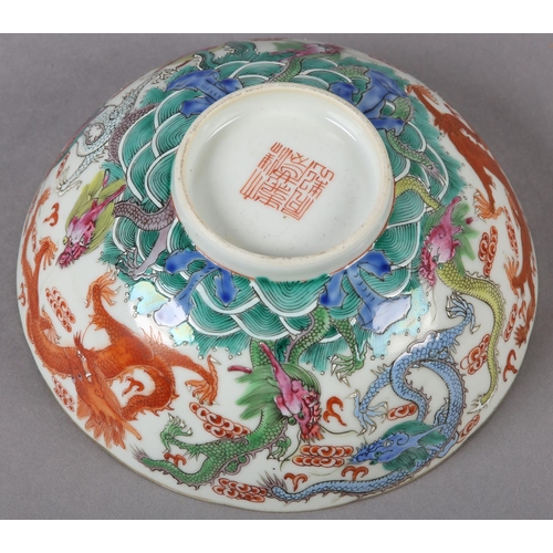 283 - A QING DYNASTY CHINESE BOWL, the body painted in polychrome enamels with intertwining dragons among ... 