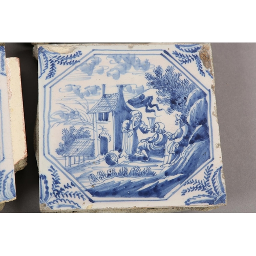 277 - A COLLECTION OF 18TH CENTURY DELFT BLUE AND WHITE TILES, variously painted with figures camped on th... 