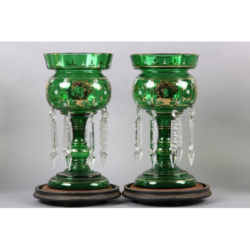 214 - A PAIR OF 19TH CENTURY BOHEMIAN GLASS LUSTRES with gilt decoration to the bowl, with hanging prismat... 