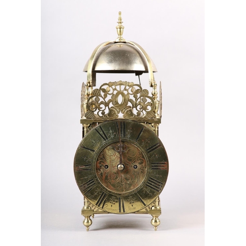 228 - A 18TH CENTURY STYLE FOUR POST BRASS LANTERN CLOCK, two train movement striking on a strap mounted b... 