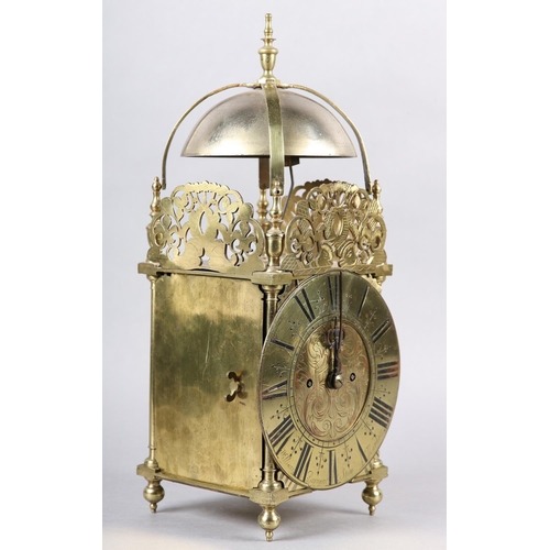 228 - A 18TH CENTURY STYLE FOUR POST BRASS LANTERN CLOCK, two train movement striking on a strap mounted b... 