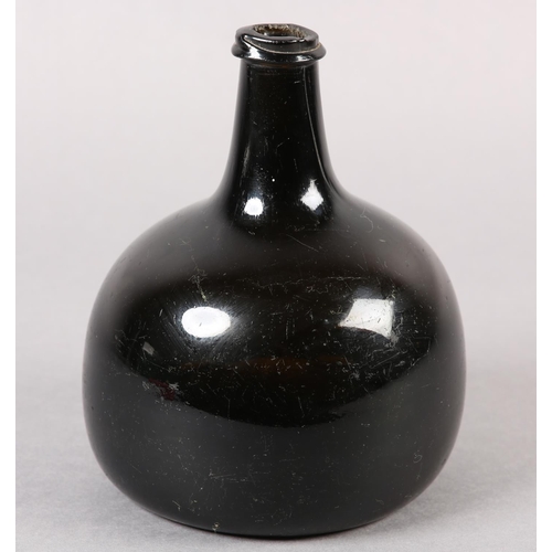 209 - AN EARLY 18TH CENTURY ONION BOTTLE of dark olive-green tint, hand-blown, the rounded body with taper... 