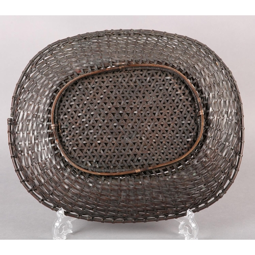 285 - A JAPANESE BRONZE 'BASKET' WALL PLAQUE, the centre panel incised and applied with a spray of blossom... 