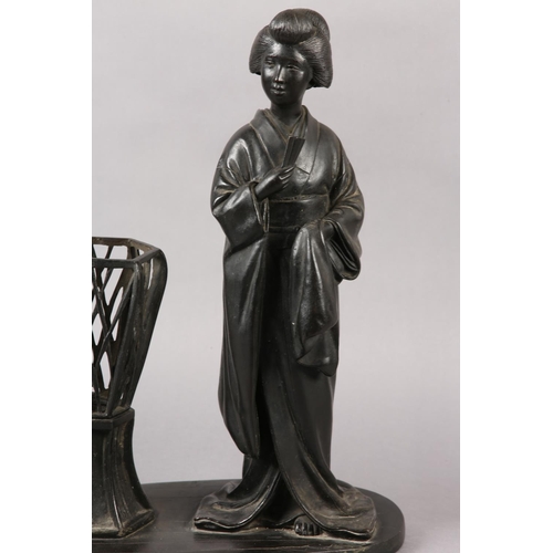 286 - A JAPANESE BRONZE TABLE LAMP in the form of a bijin standing beside a raised basket, on oval base, s... 