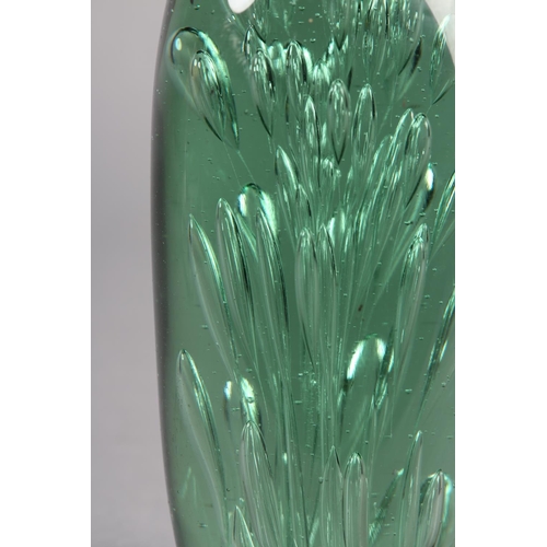 211 - A 19TH CENTURY GREEN GLASS DUMP with bubble inclusions, 17.5cm high