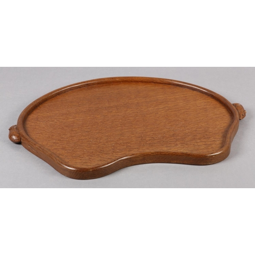 457 - THOMPSON OF KILBURN 'MOUSEMAN', An oak kidney-shaped tray with raised rim, carved in relief with two... 