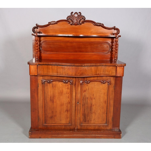 476 - A MID VICTORIAN MAHOGANY CHIFFONIER of serpentine outline having a raised back of arched profile wit... 