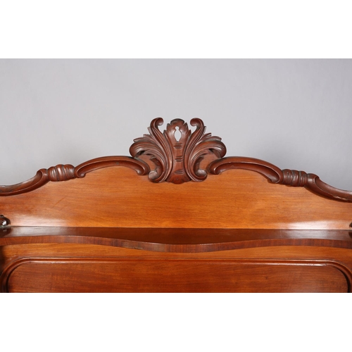 476 - A MID VICTORIAN MAHOGANY CHIFFONIER of serpentine outline having a raised back of arched profile wit... 