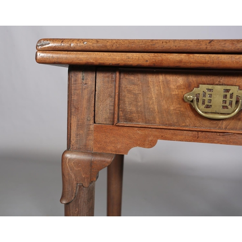 478 - A GEORGE III MAHOGANY TEA TABLE having a rectangular fold over top above a drawer to the apron, late... 