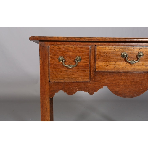 487 - AN EARLY 19TH CENTURY OAK SIDE TABLE, having three drawers to the ogee apron, on square chamfered le... 