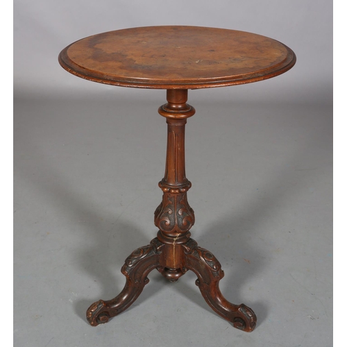 477 - A VICTORIAN FIGURED WALNUT TRIPOD TABLE, circular, on a fluted and foliate vase pedestal on three ca... 