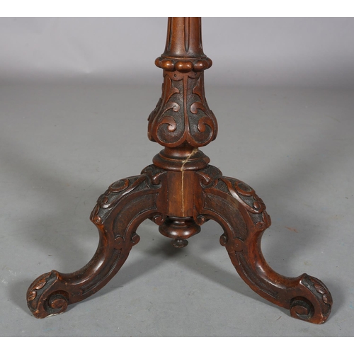 477 - A VICTORIAN FIGURED WALNUT TRIPOD TABLE, circular, on a fluted and foliate vase pedestal on three ca... 