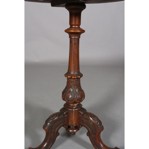 477 - A VICTORIAN FIGURED WALNUT TRIPOD TABLE, circular, on a fluted and foliate vase pedestal on three ca... 