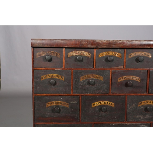 492 - A 19TH CENTURY BANK OF APOTHECARY'S DRAWERS, pine, with ebonised and labelled drawer fronts, of four... 