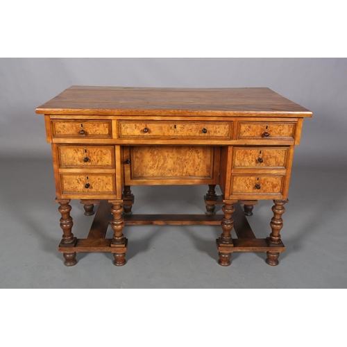 469 - A 19TH CENTURY FIGURED AND SATIN WALNUT DRESSING TABLE, possibly French, having three indented panel... 