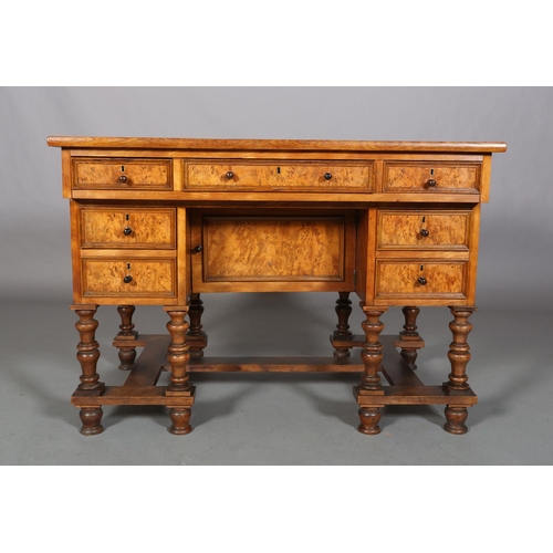 469 - A 19TH CENTURY FIGURED AND SATIN WALNUT DRESSING TABLE, possibly French, having three indented panel... 