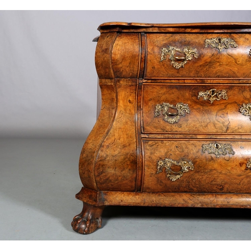 467 - A 18TH CENTURY DUTCH FIGURED WALNUT BOMBE COMMODE, the quarter veneered top of serpentine outline, a... 