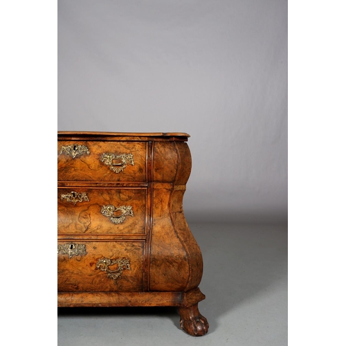 467 - A 18TH CENTURY DUTCH FIGURED WALNUT BOMBE COMMODE, the quarter veneered top of serpentine outline, a... 