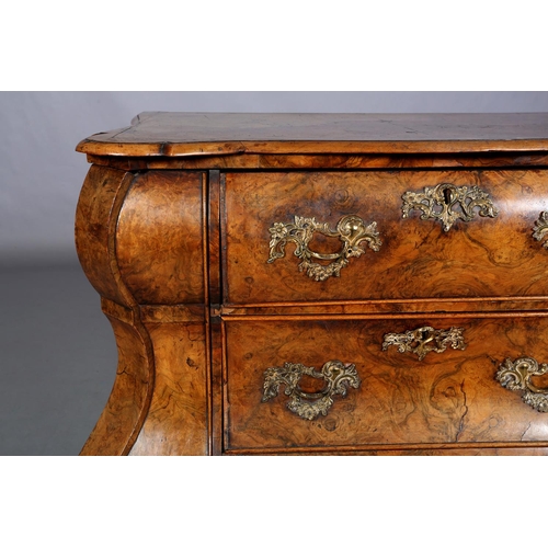 467 - A 18TH CENTURY DUTCH FIGURED WALNUT BOMBE COMMODE, the quarter veneered top of serpentine outline, a... 