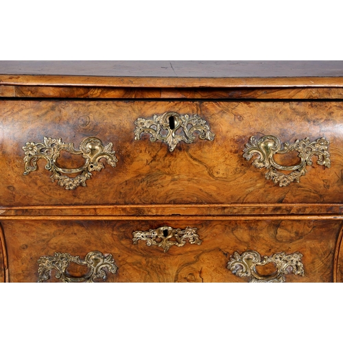 467 - A 18TH CENTURY DUTCH FIGURED WALNUT BOMBE COMMODE, the quarter veneered top of serpentine outline, a... 