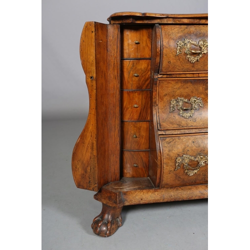 467 - A 18TH CENTURY DUTCH FIGURED WALNUT BOMBE COMMODE, the quarter veneered top of serpentine outline, a... 