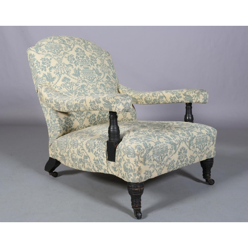 470 - A 19TH CENTURY ARMCHAIR IN THE STYLE OF HOWARD & SONS, the rounded back, arms and low seat upholster... 