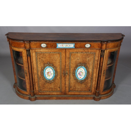 472 - A VICTORIAN FIGURED WALNUT CREDENZA OR SIDE CABINET with gilt metal mounts and floral painted porcel... 