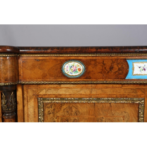 472 - A VICTORIAN FIGURED WALNUT CREDENZA OR SIDE CABINET with gilt metal mounts and floral painted porcel... 