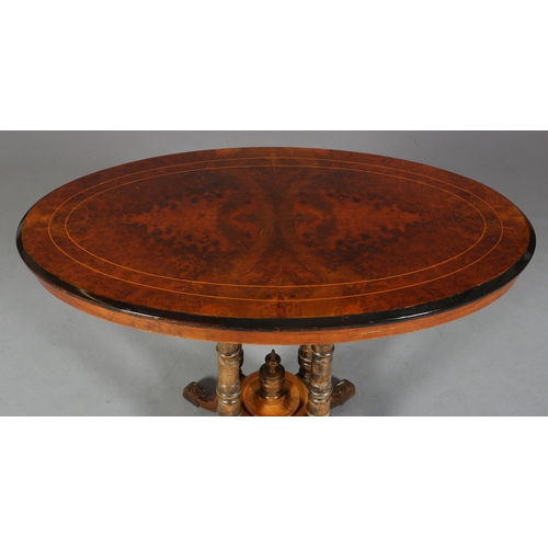 473 - A VICTORIAN BURR WALNUT OVAL WINDOW TABLE, inlaid in boxwood stringing and ebonised rim, on four tur... 