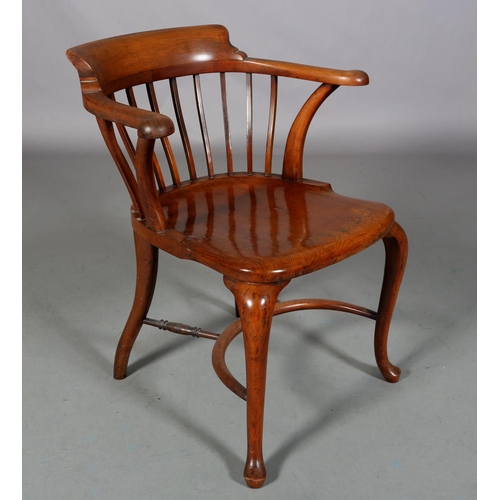 490 - AN 19TH CENTURY MAHOGANY BOW ARMCHAIR, having a railed back, full seat on cabriole legs joined by a ... 